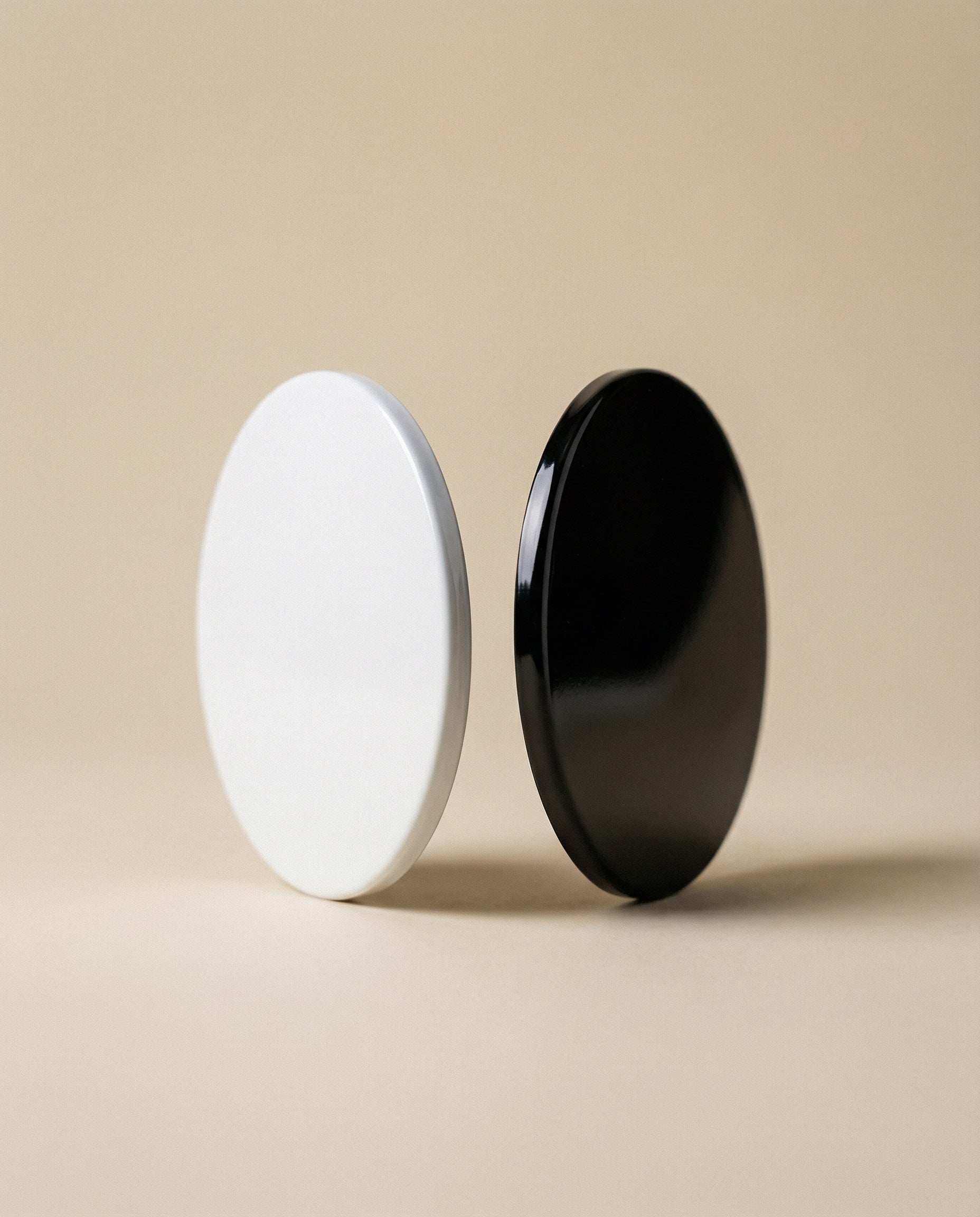Glossy black candle lid from AEMBR Deluxe collection, designed to fit standard candle jars with a smooth finish.