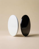 Glossy black candle lid from AEMBR Deluxe collection, designed to fit standard candle jars with a smooth finish.
