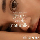 AEMBR ALKYMIST Luxe Amber Oud multi-use fragrance bottle with elegant gold accents and amber-colored liquid.