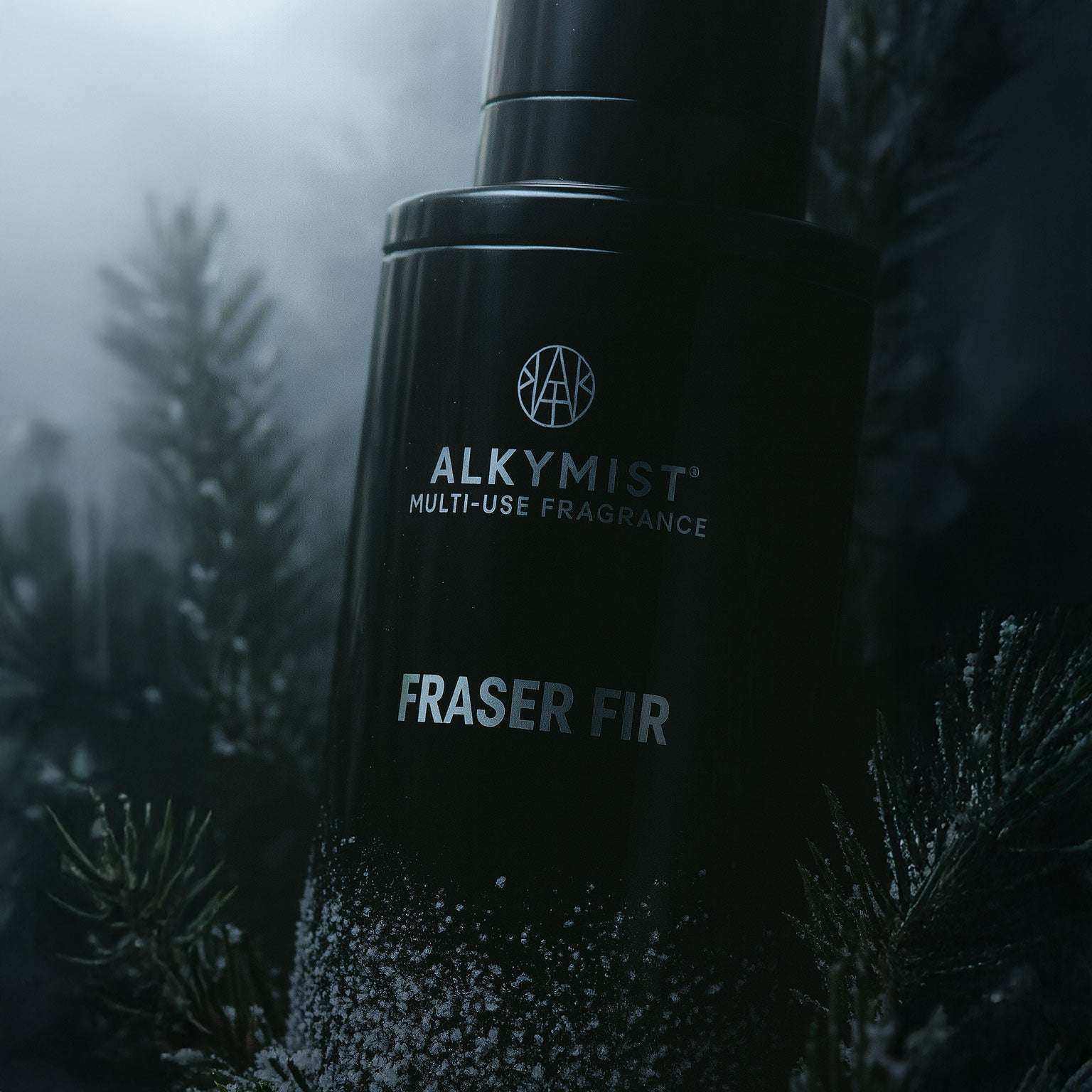 AEMBR ALKYMIST® Luxe Fraser Fir multi-use fragrance bottle with a sleek design and festive green label.