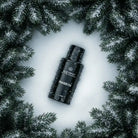 AEMBR ALKYMIST® Luxe Fraser Fir multi-use fragrance bottle with a sleek design and festive green label.