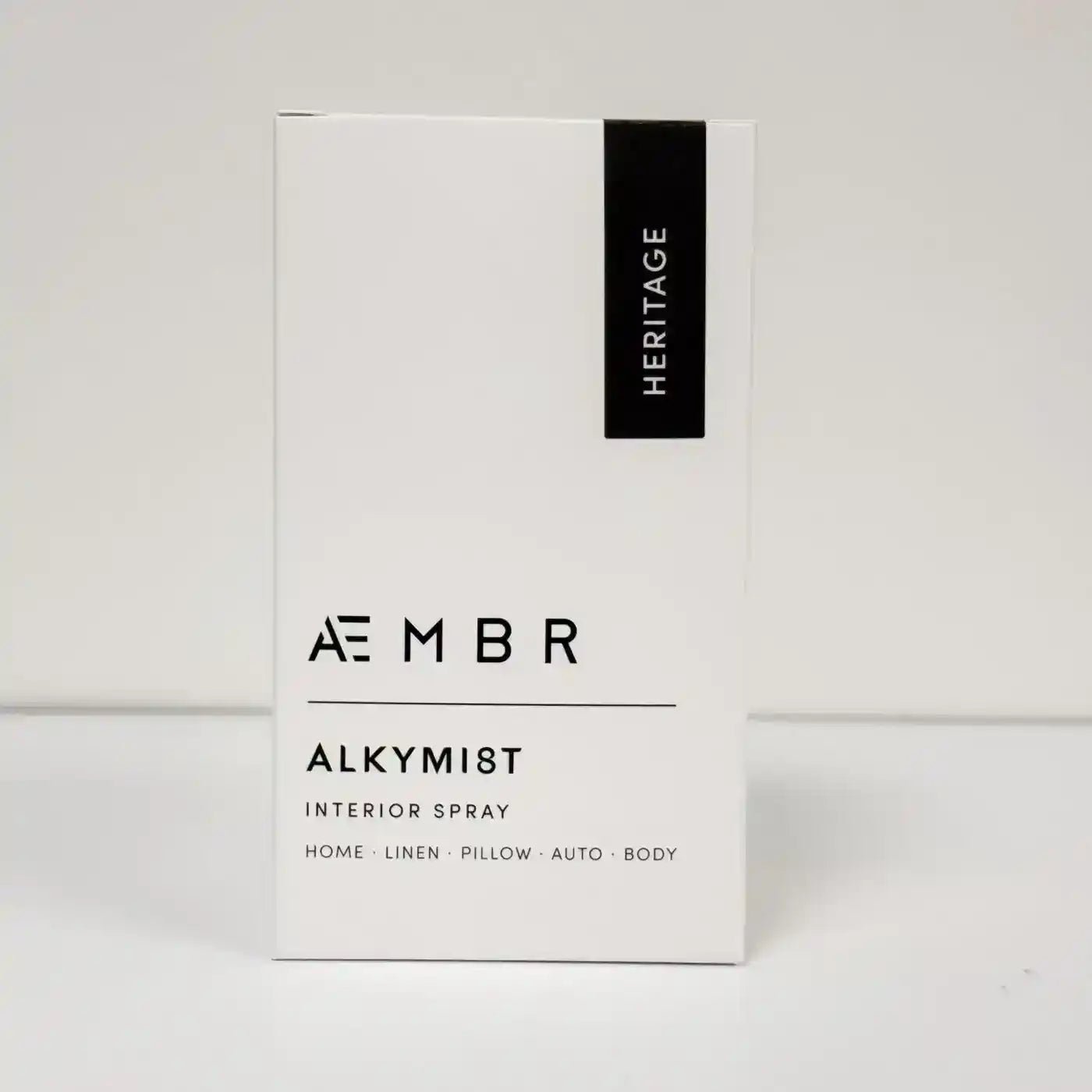 AEMBR ALKYMIST® Luxe Heritage multi-use fragrance bottle with elegant label and cap, showcasing luxurious packaging.