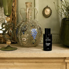 AEMBR ALKYMIST Luxe Leaves multi-use fragrance bottle with elegant leaves design on the label.