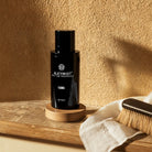 AEMBR ALKYMIST® Luxe Leaves multi-use fragrance bottle with elegant packaging and botanical leaf design.