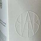 AEMBR ALKYMIST® Luxe Leaves multi-use fragrance bottle with elegant packaging and botanical leaf design.