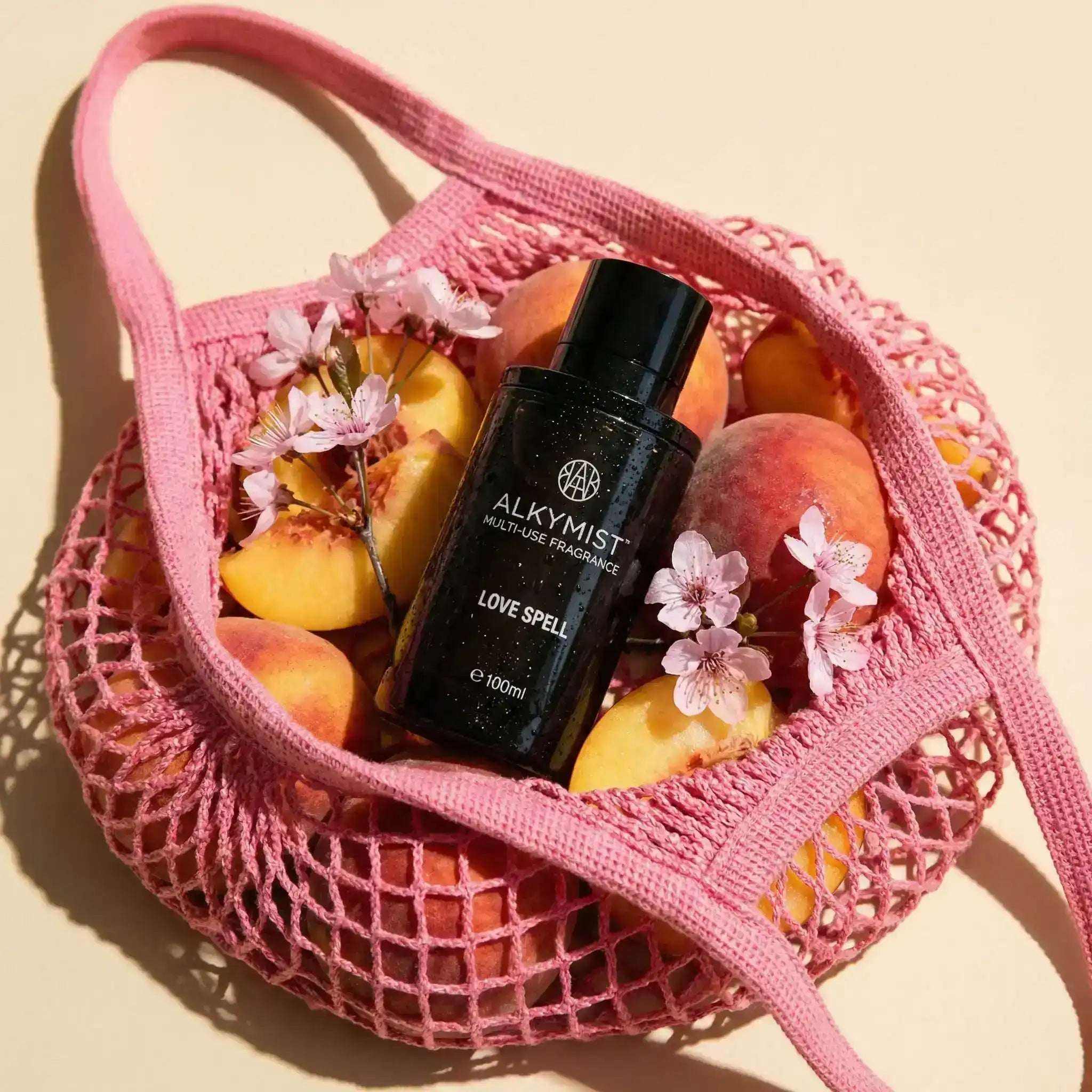 AEMBR ALKYMIST® Luxe Love Spell multi-use fragrance bottle, elegant packaging with a luxurious design.