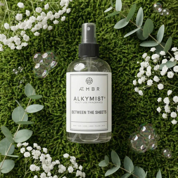 AEMBR Alkymist® Between the Sheets multi-use room spray in a sleek bottle with a spray nozzle, set on a neutral background.