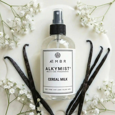 AEMBR Alkymist® Cereal Milk Room Spray, multi-use fragrance bottle with a sleek design and label featuring cereal milk scent.
