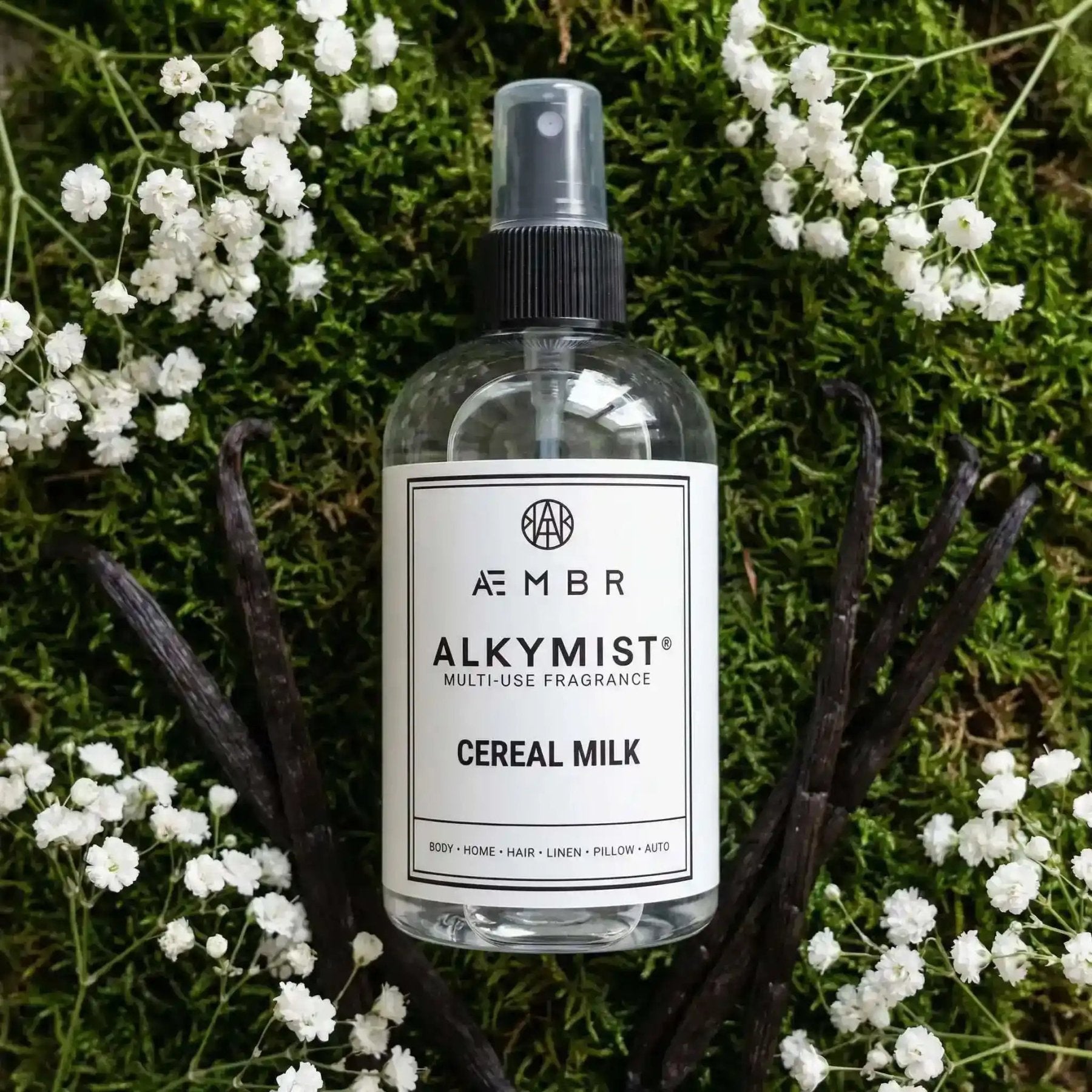 Alkymist® Cereal Milk Room Spray by AEMBR, a multi-use fragrance bottle with a sleek design and cereal milk scent.