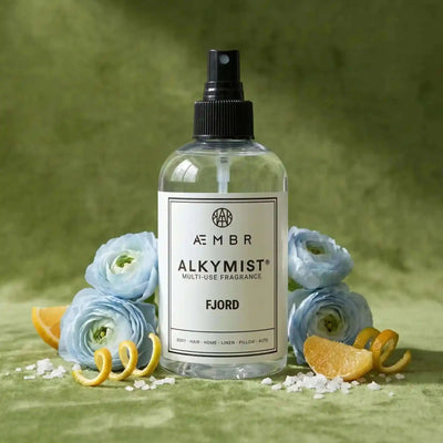 Alkymist® Fjord Room Spray by AEMBR, a multi-use fragrance with a sleek bottle and fresh, ocean-inspired scent.