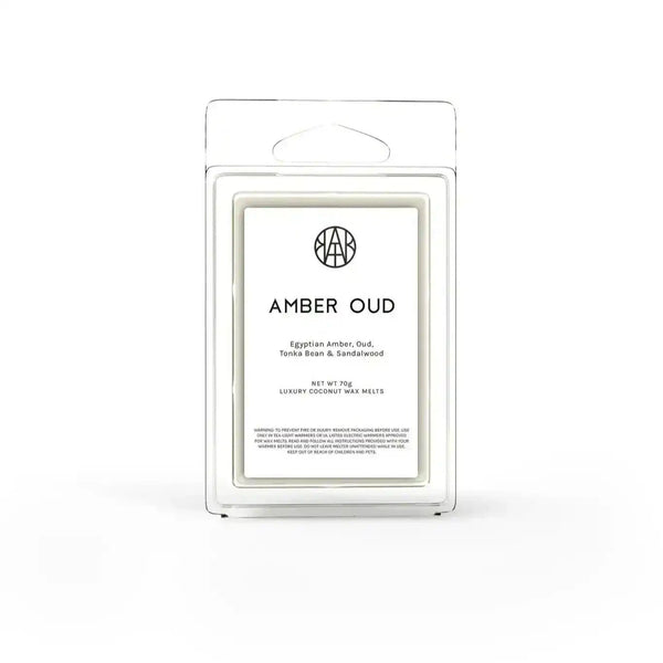 AEMBR Amber Oud Wax Melt, close-up of golden wax melt piece with a smooth surface and amber hue.