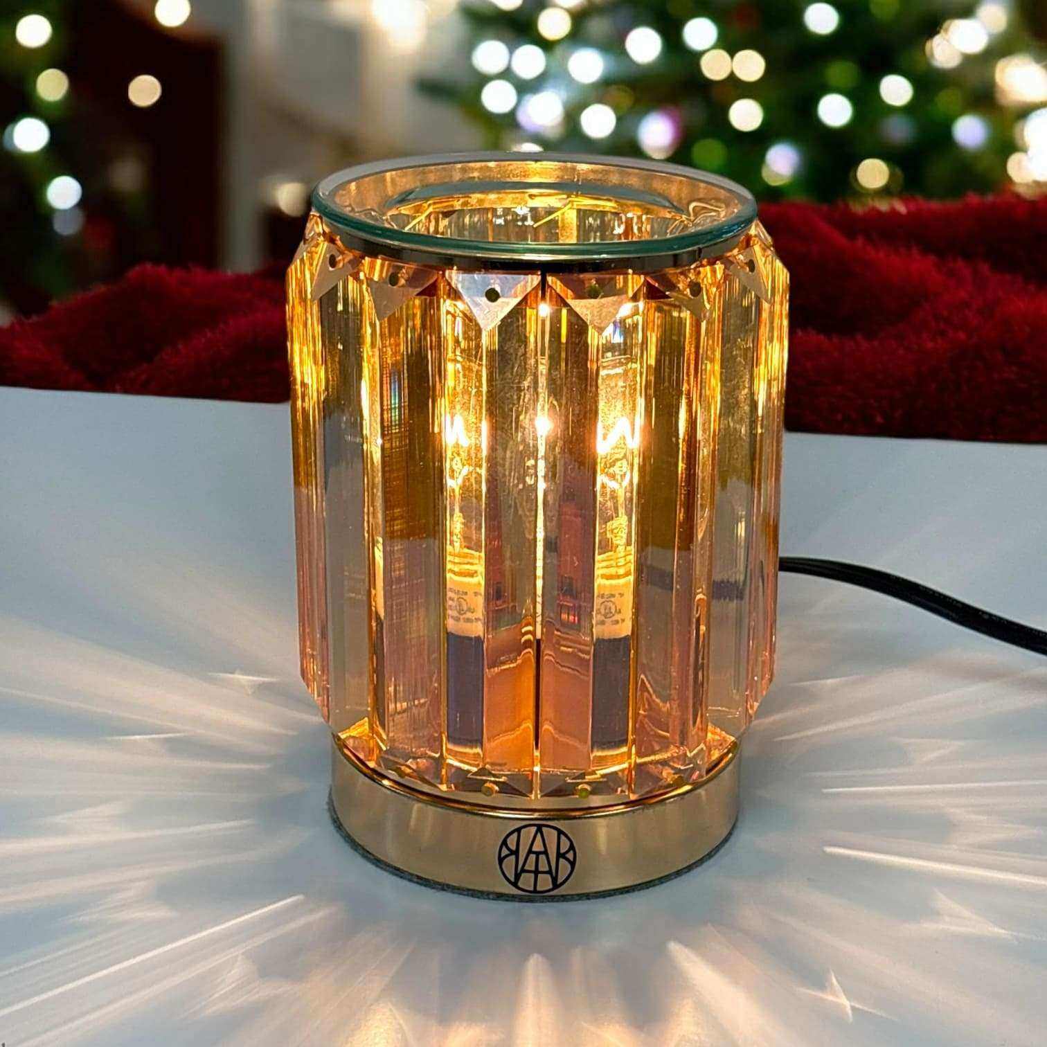 AEMBR Golden Deco wax warmer in a stylish gold finish, designed for melting scented wax in a modern home decor setting.
