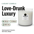 AEMBR The Valkyrie Lavender Haze candle with a sleek glass container and lavender-hued wax, emitting a soft glow.