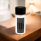 AEMBR non-toxic product canister on wooden table, labeled free of phthalates, parabens, carcinogens, mutagens.