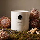 AEMBR The Viking Bibliotek candle with intricate Nordic design and dark wax, perfect for adding a Scandinavian touch.
