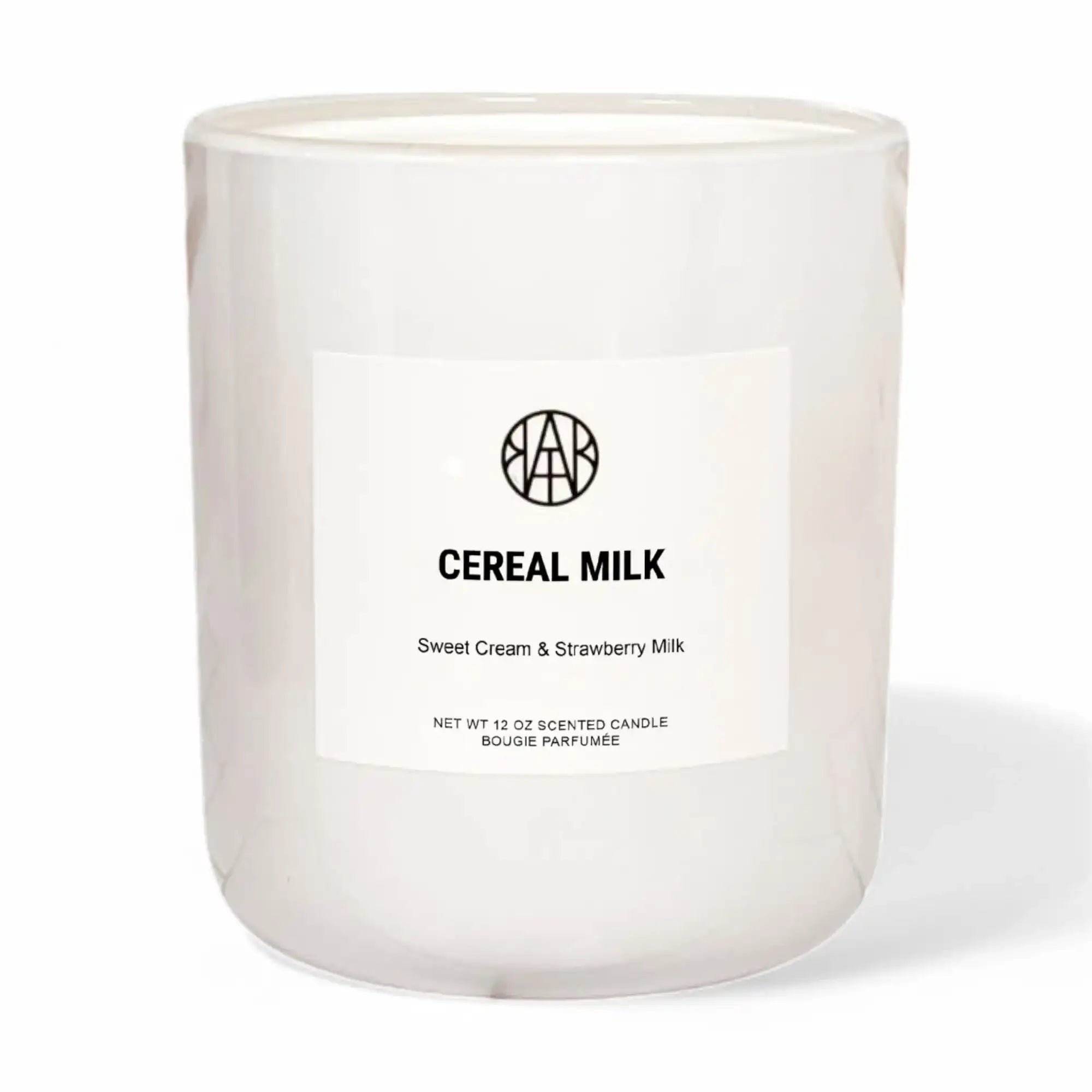 Candle labeled 'Cereal Milk' with a brand logo on a white background