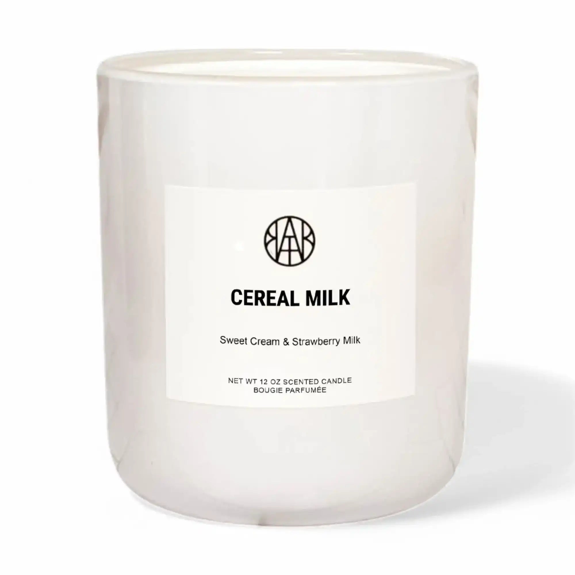 AEMBR Cereal Milk scented candle in white glass, labeled sweet cream and strawberry milk.