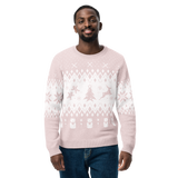 Man wearing a light pink sweater with white patterns on a white background