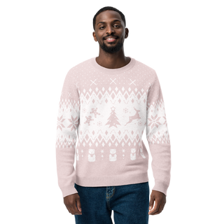 Man wearing a light pink sweater with white patterns on a white background