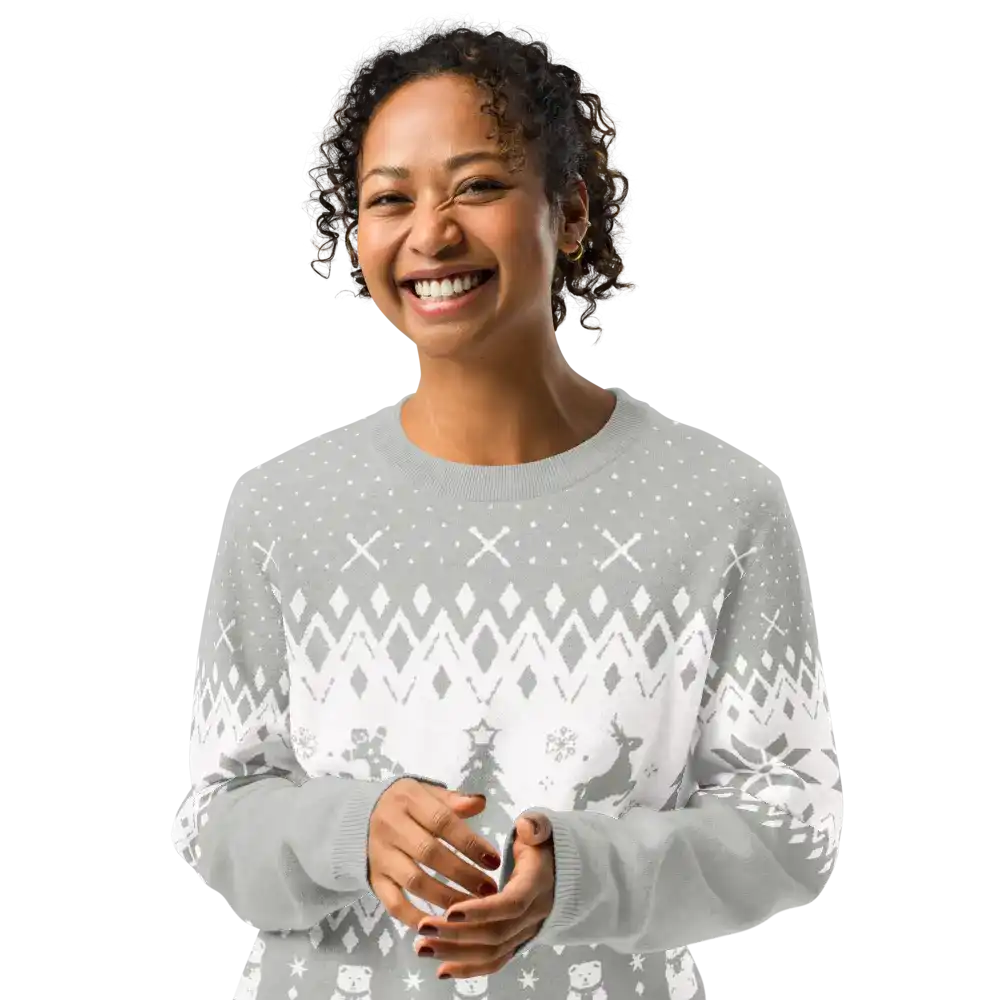 Smiling woman wearing AEMBR classic fit knitted crew neck sweater with winter pattern