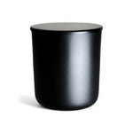 Matte black lidded candle jar, AEMBR non-toxic home fragrance product.