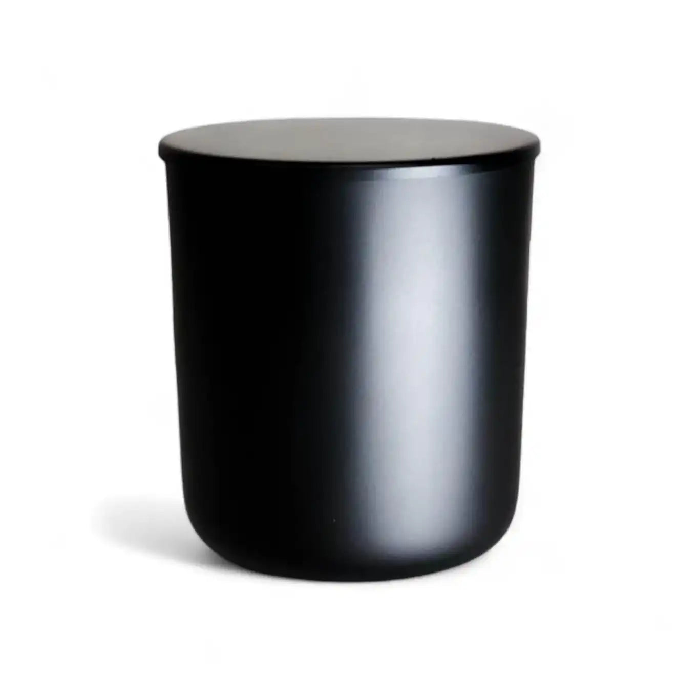 Matte black lidded candle jar, AEMBR non-toxic home fragrance product.