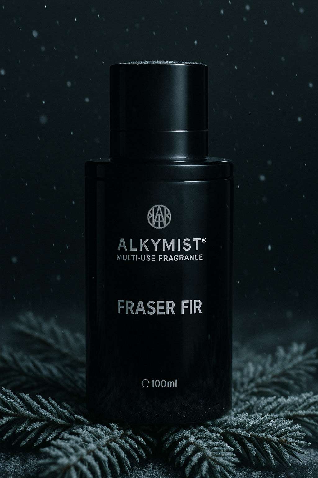 Black fragrance bottle labeled 'Alkymist Fraser Fir' on a dark background with foliage.