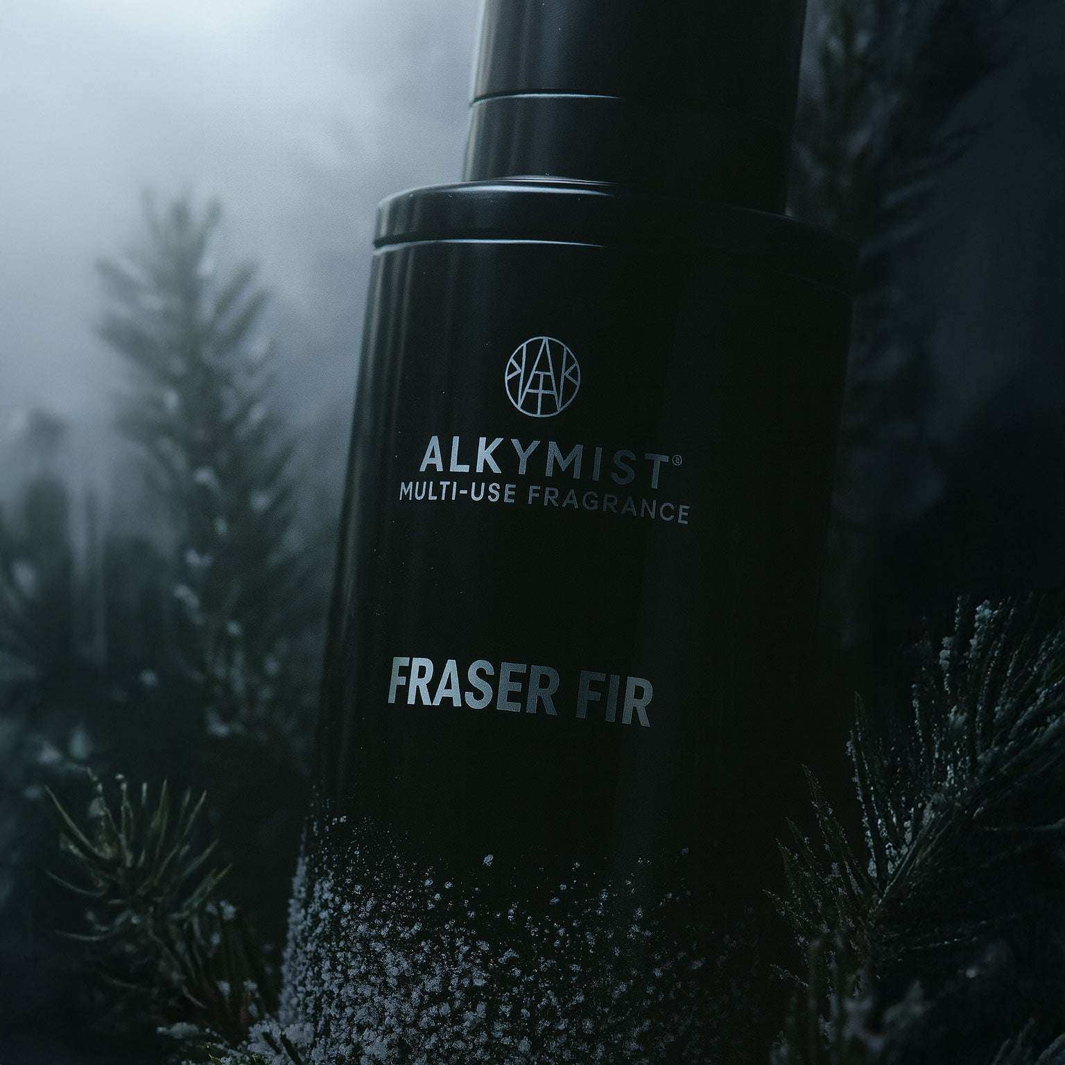 AEMBR Alkymist Fraser Fir multi-use fragrance bottle with frosted pine needles