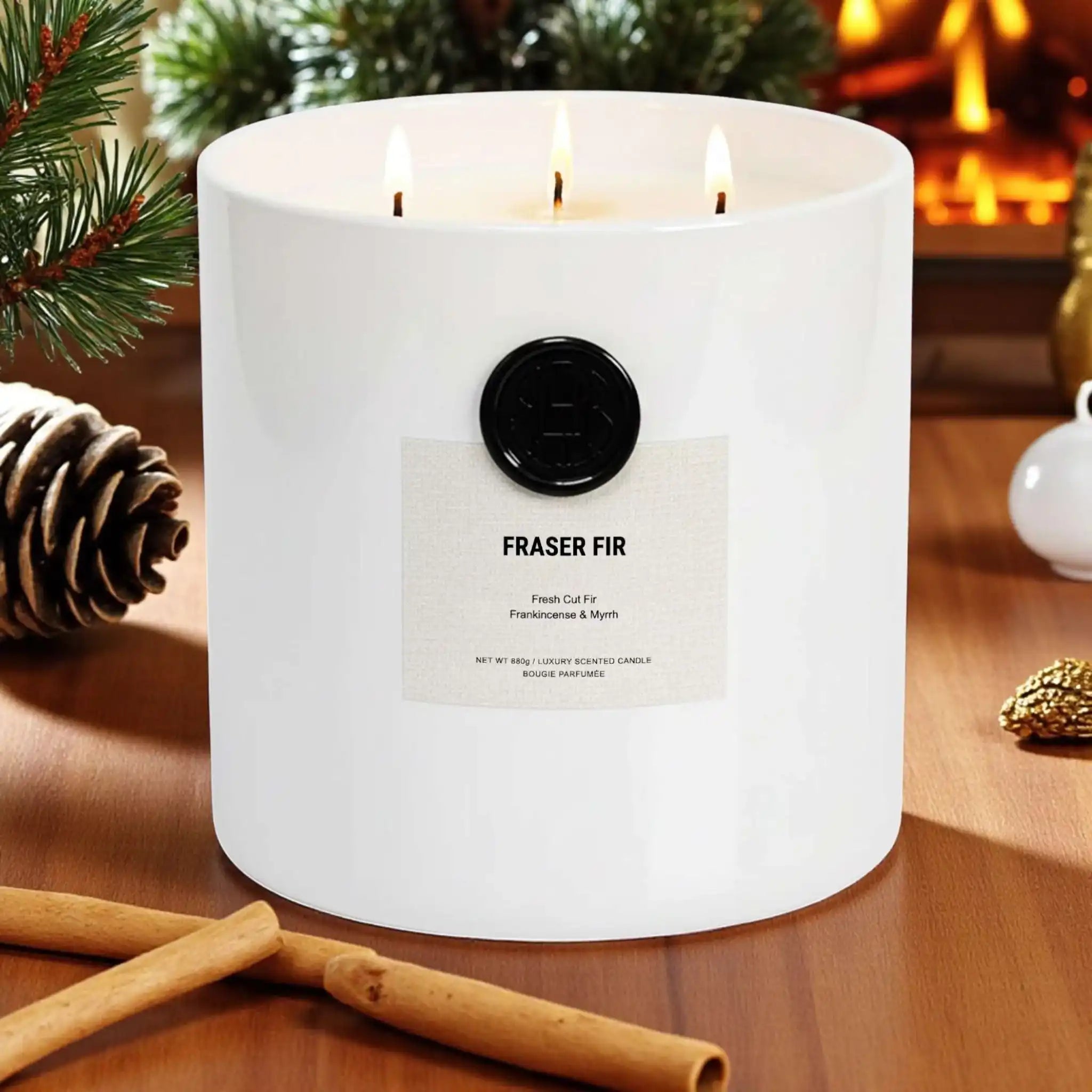 AEMBR Fraser Fir candle in white jar with pine and cinnamon, cozy holiday setting.