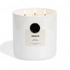 AEMBR Fraser Fir luxury scented candle in white jar with three lit wicks on white background