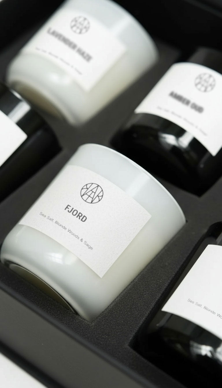 Set of candles with labels on a black background