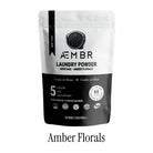 AEMBR Amber Florals laundry powder pouch, non-toxic, for 65 loads, on white background