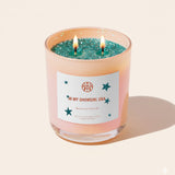 Candle with a label on a beige background