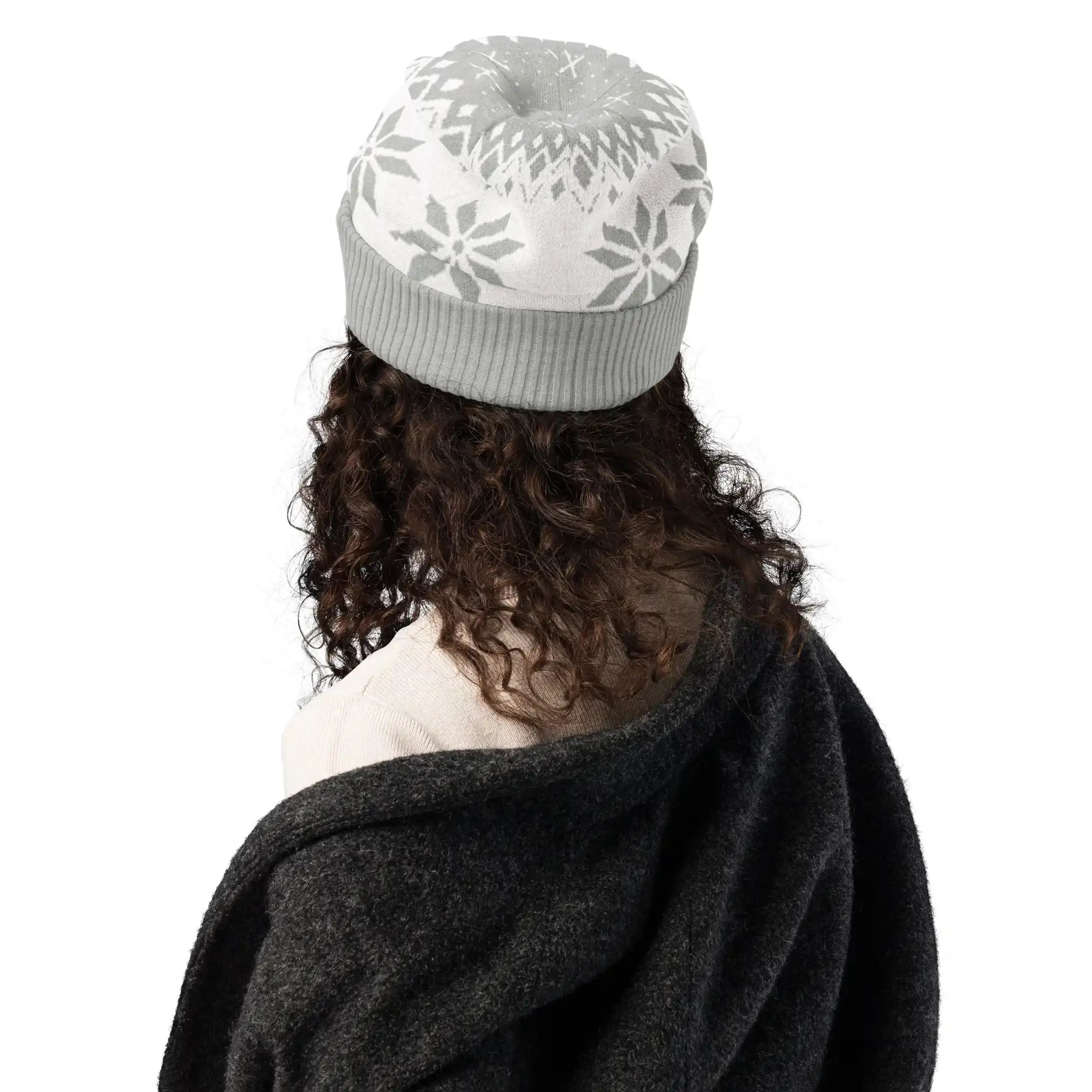 AEMBR knitted beanie in light grey with snowflake pattern, modeled from the back