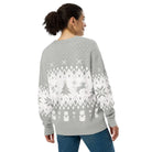 AEMBR woman in gray and white holiday knit cardigan with festive tree and bear pattern, back view