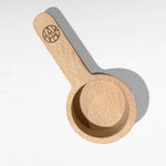 AEMBR wooden laundry detergent scoop on white background, eco-friendly home accessory