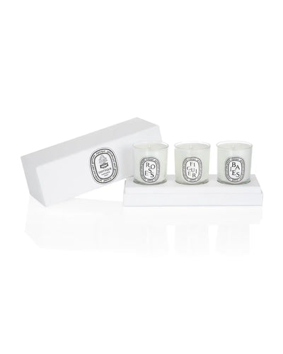 Set of three non-toxic scented candles in clear glass jars with white labels, displayed in a white box.