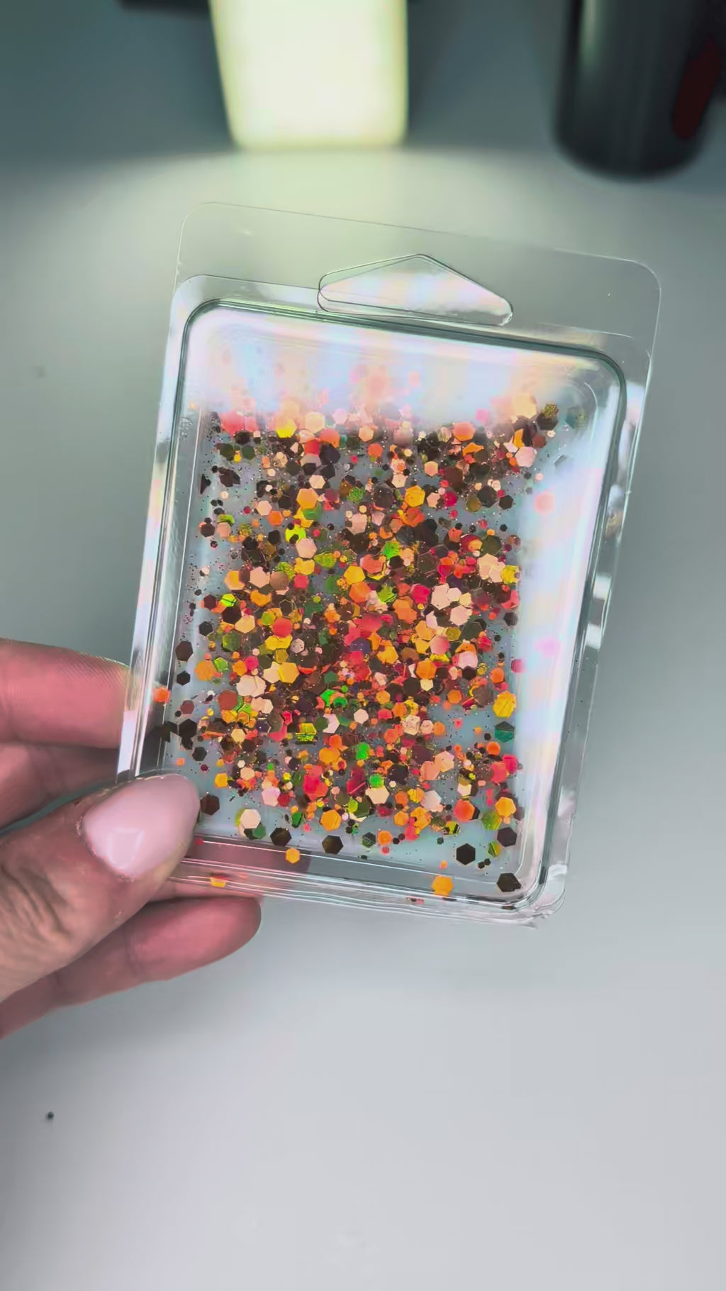 Taylor Swift inspired showgirl era wax melt with teal wax and orange glitter by Aembr