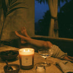 AEMBR salt candle burning by bath, non-toxic home fragrance, cozy nighttime relaxation scene