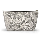 AEMBR travel pouch bag with black contour line pattern on cream background and zipper closure