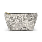 AEMBR beige travel pouch bag with black contour line pattern and gold zipper on white background