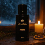 Black Alkymist Juletid fragrance bottle with a candle and decorative elements in the background