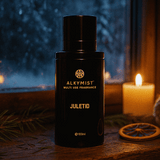 Black Alkymist Juletid fragrance bottle with a candle and decorative elements in the background