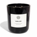 AEMBR luxury black glass candle with VANILLUXE label, non-toxic home fragrance.